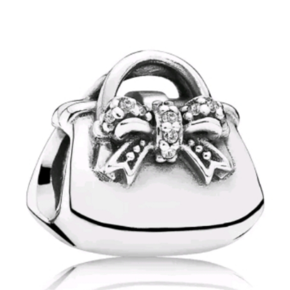 Pandora sparkling handbag charm.